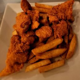 a plate of fried chicken and french fries