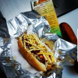 The Latin Corner - Hot Dog Boricua: Topped with seasoned ground beef, sauerkraut, cheese, ketchup, mustard, potato sticks