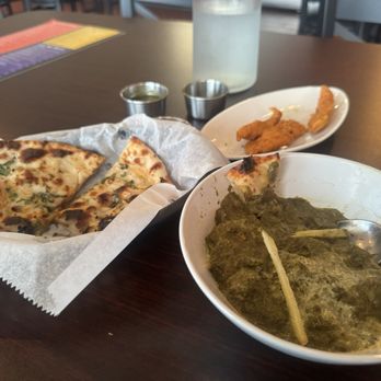 Tikka Temple - Half eaten Palak Paneer, Chicken pakora, garlic naan - Indian Near Me - Katy, Texas Tikka Temple - Half eaten Palak Paneer, Chicken pakora, garlic naan - Indian Near Me - Katy, Texas