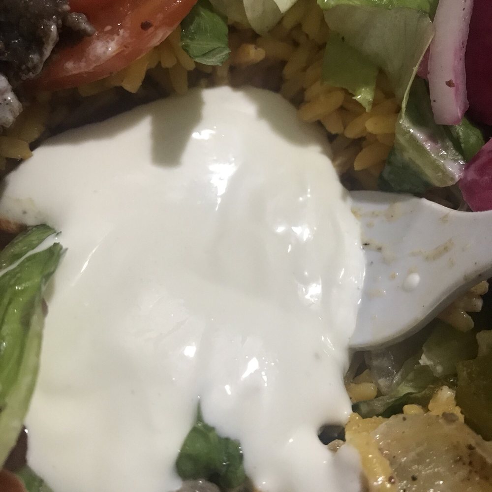 Shawarmania - This is their Side of Tzatziki Sauce... it's plain yogurt with tap water poured in. - Halal Near Me - Astoria, New York