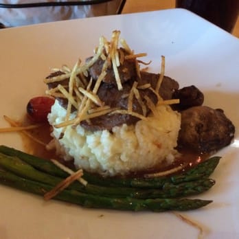 Mythos Restaurant - Parm risotto with beef tips in Jack Daniel sauce - New American Near Me - Orlando, Florida Mythos Restaurant - Parm risotto with beef tips in Jack Daniel sauce - New American Near Me - Orlando, Florida