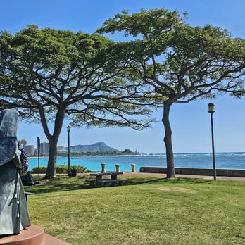 Saint Marianne Cope Statue - To her left is a clear view of Diamond Head - Landmarks & Historical Buildings Near Me - Honolulu, Hawaii Saint Marianne Cope Statue - To her left is a clear view of Diamond Head - Landmarks & Historical Buildings Near Me - Honolulu, Hawaii