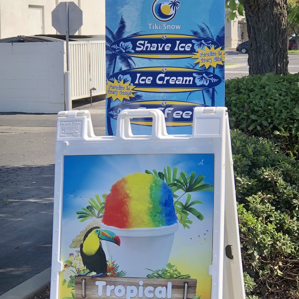 a sign for a tropical ice cream shop a sign for a tropical ice cream shop