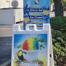 a sign for a tropical ice cream shop a sign for a tropical ice cream shop