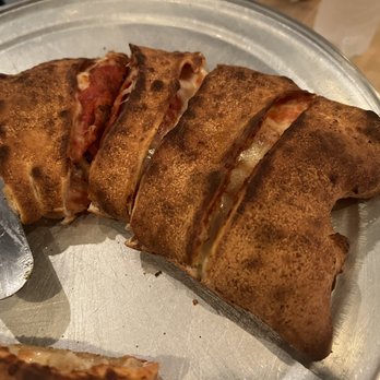 Via Capri Pizzeria - The small Pepperoni, sausage, ham calzone - Pizza Near Me - Kissimmee, Florida Via Capri Pizzeria - The small Pepperoni, sausage, ham calzone - Pizza Near Me - Kissimmee, Florida