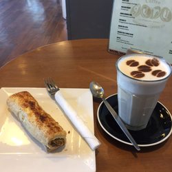 Coffee Guru - A spinach and feta roll with a Chai latte