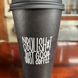 a cup of coffee on a table a cup of coffee on a table