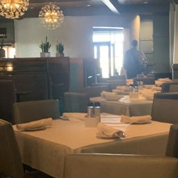 Plenty of room at tables. Not a crowded seating area Plenty of room at tables. Not a crowded seating area