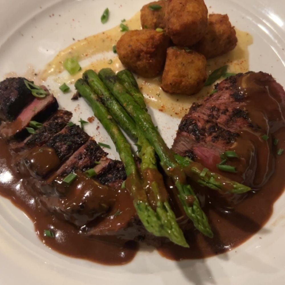 Fire and Smoke Gastropub - Long Island Steak with bleu cheese Demi glacé, asparagus, and garlic parm tator tots. So good! - Steakhouses Near Me - Myrtle Beach, South Carolina