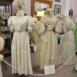 Victorian Bridal Museum - Display of Victorian bridal gowns on the left side of the shop