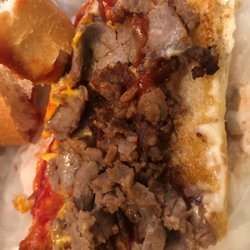 Lots of Ketchup and mayo on sandwich. American cheese.