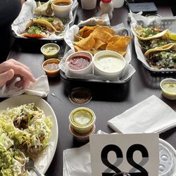 Taco Rey - Fajita taco salad, cheese dip, salsa, corn carnitas tacos, seat tacos and a birria taco.