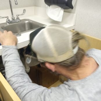 Same Day Plumbing - Checking a trap for leaks in a commercial store. - Plumbing Near Me Same Day Plumbing - Checking a trap for leaks in a commercial store. - Plumbing Near Me