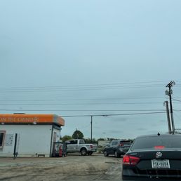 cars parked in front of a coffee shop cars parked in front of a coffee shop