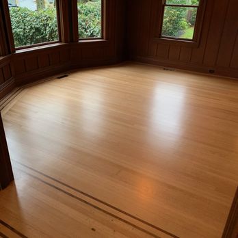 Golden Hardwood Floors - a room with wood paneling - Flooring Near Me - Seattle, Washington Golden Hardwood Floors - a room with wood paneling - Flooring Near Me - Seattle, Washington