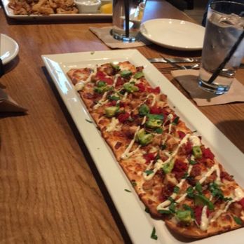 BJ's Restaurant & Brewhouse - California club flatbread and calamari in the back. - New American Near Me - Fort Wayne, Indiana BJ's Restaurant & Brewhouse - California club flatbread and calamari in the back. - New American Near Me - Fort Wayne, Indiana