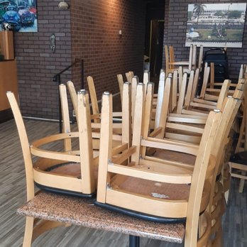 Surulere Suya Spot - Empty table and chairs that we couldn't sit on for over 45MINS! Infuriating! - African Near Me - Union, New Jersey