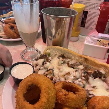 Mel's Hard Luck Diner - Cheesesteak hoagie w/ onion rings and a chocolate milkshake - Diners Near Me - Branson, Missouri Mel's Hard Luck Diner - Cheesesteak hoagie w/ onion rings and a chocolate milkshake - Diners Near Me - Branson, Missouri