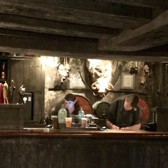 Three Broomsticks - Bar area of Three Broomsticks. The boar mounted on the wall moves every 3 min - British Near Me - Orlando, Florida Three Broomsticks - Bar area of Three Broomsticks. The boar mounted on the wall moves every 3 min - British Near Me - Orlando, Florida
