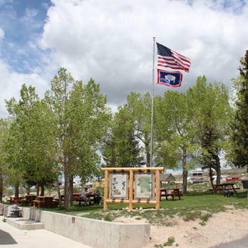 Daniel Junction - an american flag flying over a picnic area - RV Parks Near Me - Daniel, Wyoming