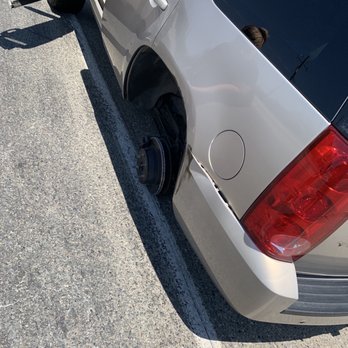 Tires To Go - This is the damage, the fender is dented and rinkled, rotor chewed and bent, and studs all stripped - Tires Near Me - Hanford, California Tires To Go - This is the damage, the fender is dented and rinkled, rotor chewed and bent, and studs all stripped - Tires Near Me - Hanford, California