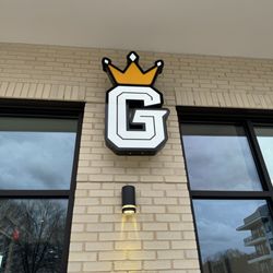 Philly G Steaks Plus - Company sign on the side of the business