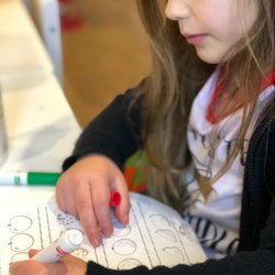 The Keiki Clubhouse Childcare & Preschool - Focused counting apples