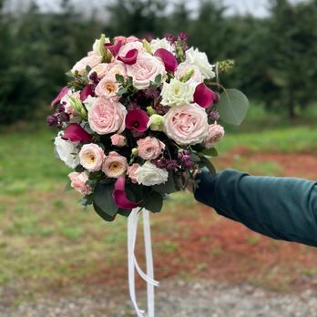 Flower Jazz - Romantic bridal bouquet with blush roses, burgundy calla lilies, white blooms, and greenery for a rich, elegant look. - Florists Near Me - Cumming, Georgia Flower Jazz - Romantic bridal bouquet with blush roses, burgundy calla lilies, white blooms, and greenery for a rich, elegant look. - Florists Near Me - Cumming, Georgia