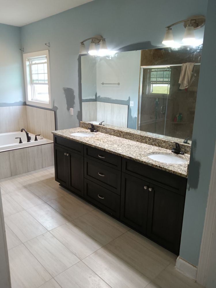 Slide of Bathmatic Custom Tile and Shower