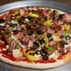 Sit 'N' Bull Saloon & Eatery - Our hand made pizzas are always a favorite, 12 inch, prices range from $11 to $16