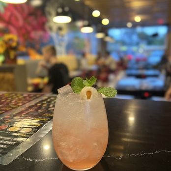 Nah Mor Hot Pot - a pink drink with a mint garnish - Hot Pot Near Me - Springfield, Virginia