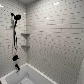 T and R Contracting - a bathtub in a bathroom - General Contractors Near Me T and R Contracting - a bathtub in a bathroom - General Contractors Near Me