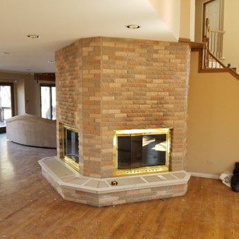 American Stone Works - a fireplace in a living room - General Contractors Near Me - Bridgeview, Illinois American Stone Works - a fireplace in a living room - General Contractors Near Me - Bridgeview, Illinois