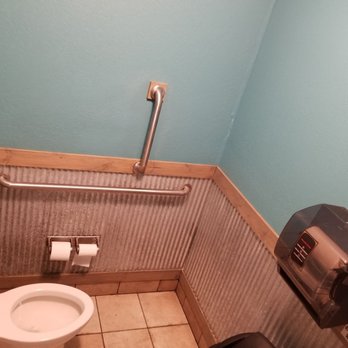G&E Burgers - a bathroom with a toilet and roll dispenser - Burgers Near Me - Williamsburg, Kentucky G&E Burgers - a bathroom with a toilet and roll dispenser - Burgers Near Me - Williamsburg, Kentucky