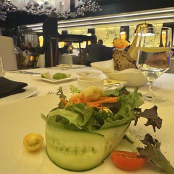 Atlantis Steakhouse - Salad wrapped with a huge cucumber peel dressing on the side - Steakhouses Near Me - RENO, Nevada