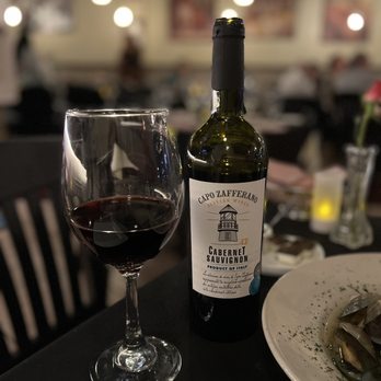 Vino E Pasta - a bottle of wine and a glass of wine - Italian Near Me - Tampa, Florida Vino E Pasta - a bottle of wine and a glass of wine - Italian Near Me - Tampa, Florida