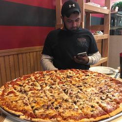 Fergaria's Pizza - Zac sizing up the competition, or is he calling for help??