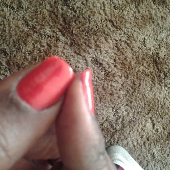 Fancy Nails - See the chip in the corner of the thumb and notice the contour of the pointer nail that ensured it could only break - Nail Salons Near Me - Modesto, California