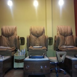 The Lion's Den Salon for Men - This is where you get your guy feet taken care of. Very manly. Look at the size of those chairs?