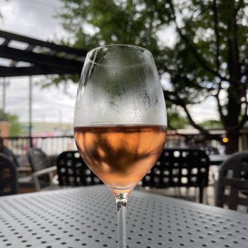 Times Ten Cellars - a glass of wine on a table - Wine Bars Near Me - Dallas, Texas Times Ten Cellars - a glass of wine on a table - Wine Bars Near Me - Dallas, Texas