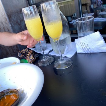 Coop 303 - The mimosas are perfect combined with the calamari we shared! Love our waitress, Kate. - New American Near Me - Atlantic Beach, Florida