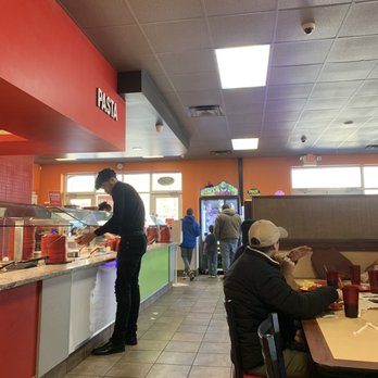 Cicis Pizza - a man serving food in a fast food restaurant - Pizza Near Me - Clarksville, Tennessee