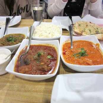 Mint - (left to right): smoky eggplant, lamb curry, chicken tikka masalas, with rice, raita and garlic naan - Indian Near Me - Laguna Hills, California Mint - (left to right): smoky eggplant, lamb curry, chicken tikka masalas, with rice, raita and garlic naan - Indian Near Me - Laguna Hills, California