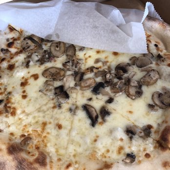 Uptop Pizzeria - White base pizza with Mushrooms. Looks like they were just thrown in there. No uniform distribution. Sad :( - Pizza Near Me - Newark, New Jersey