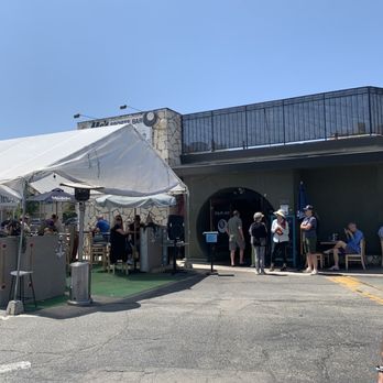 Mo's Place - a group of people standing under a white tent - Sports Bars Near Me - Playa Del Rey, California Mo's Place - a group of people standing under a white tent - Sports Bars Near Me - Playa Del Rey, California