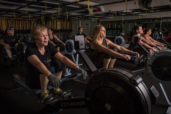 Rowing Classes at CRUfit - CRUfit pairs experienced on-the-water coaches with a friendly and focused community. Rowing training at CRUfit pairs continuous focus on technique & rhythm with fun training progressions that work for all levels... Rowing simultaneously offers effective cardiovascular training and full-body strength training. Proper rowing effectively works the big muscles in your upper legs (quadriceps and hamstrings), the upper body muscles used for stabilizing the core and prying the torso open (erector spinae, rectus abdominus, glutes and more) and the muscles used for pulling the handle through to the finish (latissimus dorsi, rhomboids, rear deltoids and biceps). In addition, rowing has been shown to be effective in building and maintaining spinal bone density. It’s no impact and works for all ages. See CRUfit Rowing Class videos in our slideshow or on our website (CRUfit.net) under Classes/Rowing. Rowing Classes at CRUfit - CRUfit pairs experienced on-the-water coaches with a friendly and focused community. Rowing training at CRUfit pairs continuous focus on technique & rhythm with fun training progressions that work for all levels... Rowing simultaneously offers effective cardiovascular training and full-body strength training. Proper rowing effectively works the big muscles in your upper legs (quadriceps and hamstrings), the upper body muscles used for stabilizing the core and prying the torso open (erector spinae, rectus abdominus, glutes and more) and the muscles used for pulling the handle through to the finish (latissimus dorsi, rhomboids, rear deltoids and biceps). In addition, rowing has been shown to be effective in building and maintaining spinal bone density. It’s no impact and works for all ages. See CRUfit Rowing Class videos in our slideshow or on our website (CRUfit.net) under Classes/Rowing.