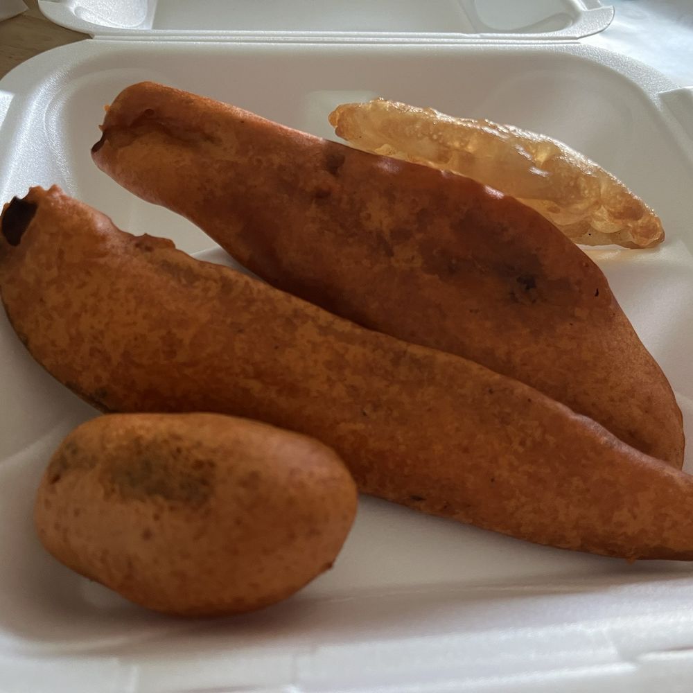 Bismillah Cafe  - Battered and fried eggplant and potato with a jalebi in the back - Indian Near Me - Atlanta, Georgia