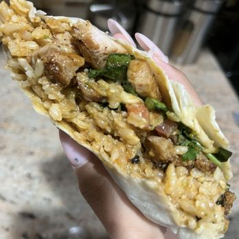 Qdoba Mexican Eats - chicken burrito w brown rice, no beans, lettuce, pico, cilantro, tortilla strips, salsa verde and salsa roja - Mexican Near Me - Fresh Meadows, New York