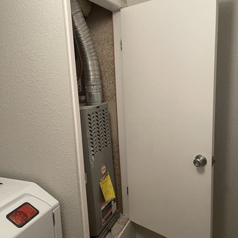 Elite Contracting Solutions - a gas furnace installed in a laundry room - General Contractors Near Me - Victorville, California Elite Contracting Solutions - a gas furnace installed in a laundry room - General Contractors Near Me - Victorville, California