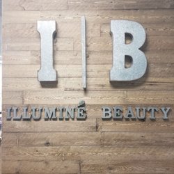 Illuminé Beauty - Accent wood wall inside the studio.